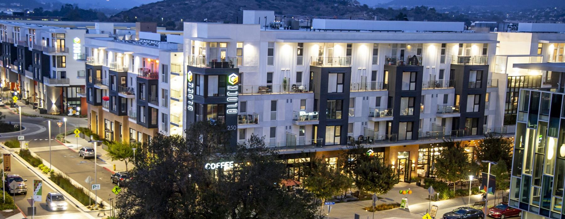 a large building with a parking lot
