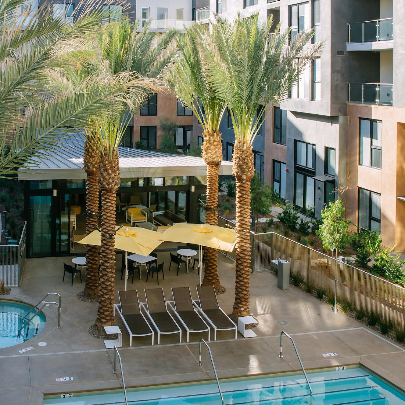 a pool in a courtyard between buildings