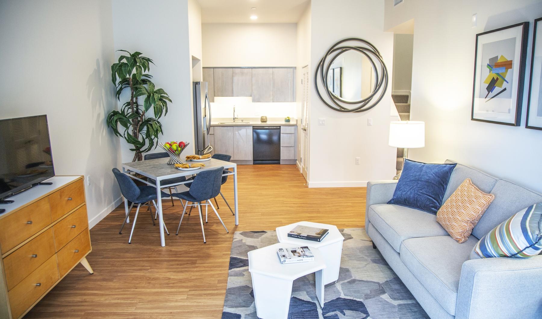 a living room with a table and chairs